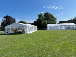 two marquees on a sunny day